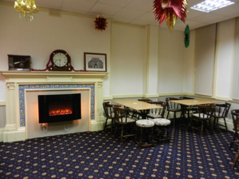 The bar lounge with its fireplace and small tables