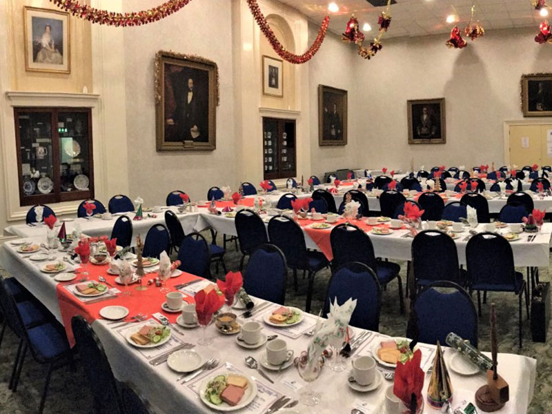 Long tables laid for a festive luncheon in the Main Function Room